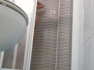 Spying on captivating Wife Shaving Pussy in Shower